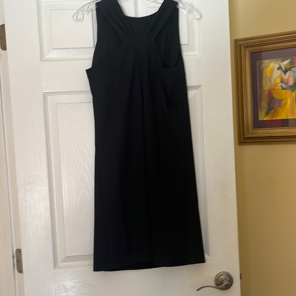 KOEL size four. 35” in length. Back zip. Cut out on back.